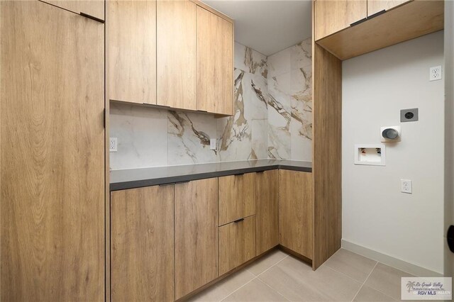 kitchen with backsplash, light brown cabinetry, and light tile patterned floors