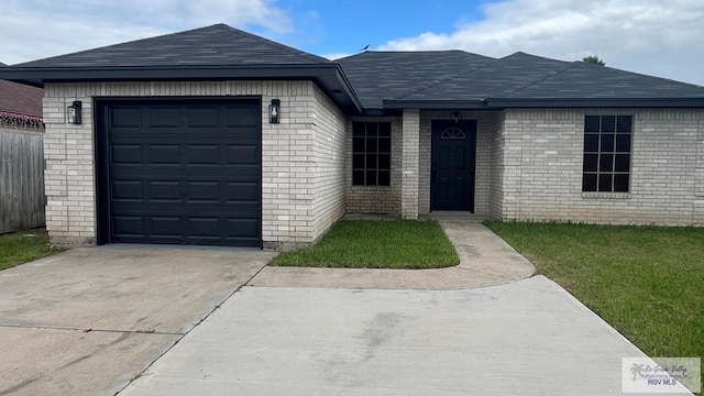 single story home featuring a garage