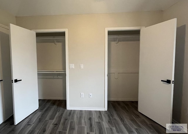 unfurnished bedroom featuring dark wood-type flooring