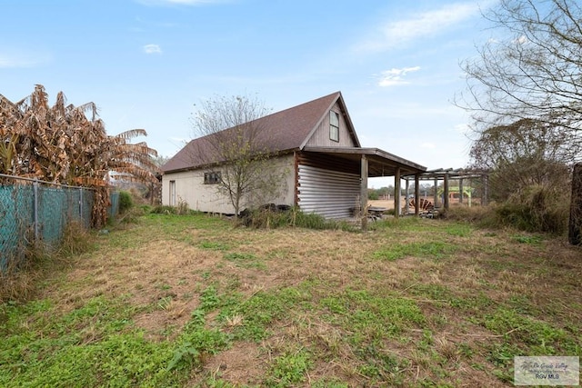 view of side of property featuring a pergola