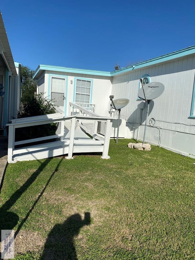 entrance to property with a yard