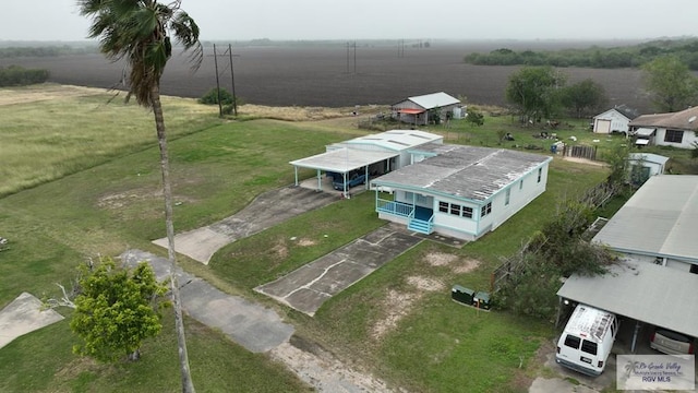 birds eye view of property with a rural view