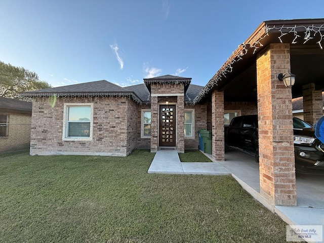 exterior space featuring a front yard and a carport