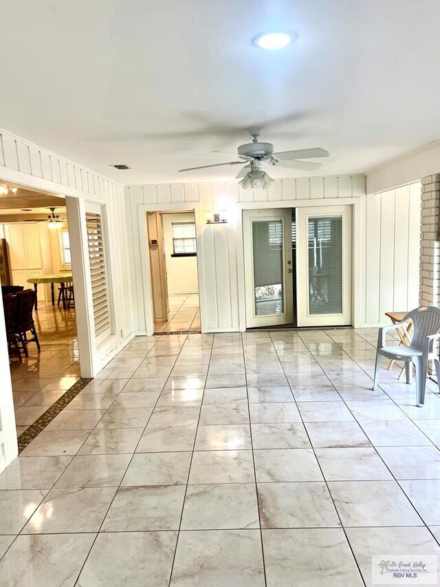 501 W Palm Valley Dr, Harlingen, TX 78552 - spare room featuring ceiling fan and light marble finish floors