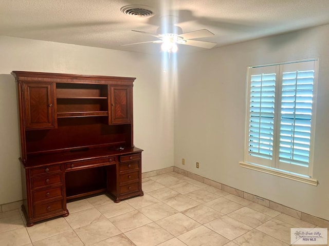 501 W Palm Valley Dr, Harlingen, TX 78552 - unfurnished office featuring baseboards, a ceiling fan, a textured ceiling, and visible vents