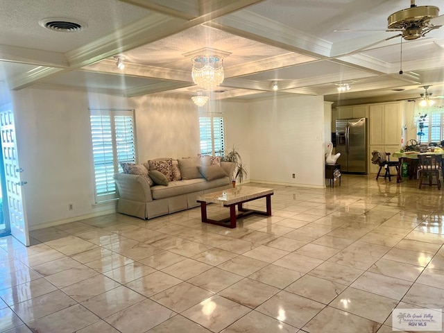 501 W Palm Valley Dr, Harlingen, TX 78552 - living area with ceiling fan with notable chandelier, visible vents, coffered ceiling, and a healthy amount of sunlight