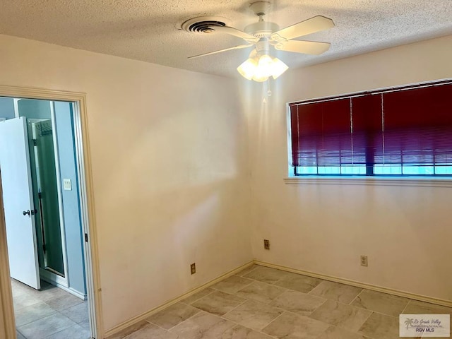 501 W Palm Valley Dr, Harlingen, TX 78552 - unfurnished room with a textured ceiling, a ceiling fan, baseboards, and visible vents