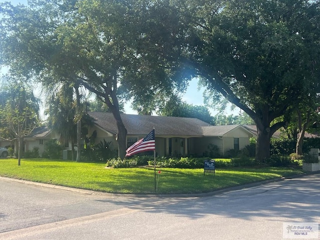 501 W Palm Valley Dr, Harlingen, TX 78552 - ranch-style home with a front lawn