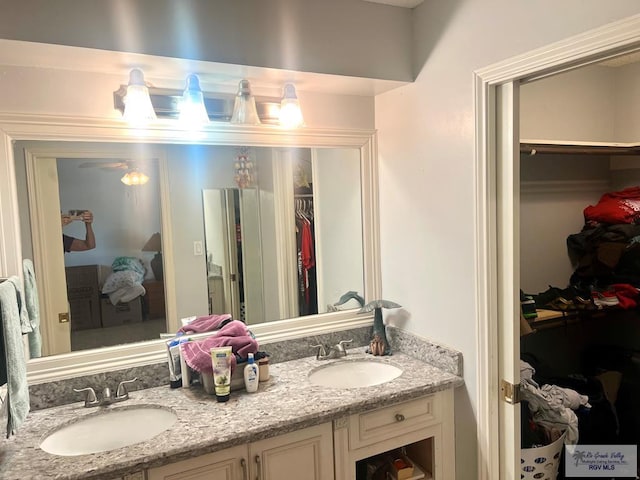 501 W Palm Valley Dr, Harlingen, TX 78552 - full bathroom featuring a spacious closet, a sink, and double vanity