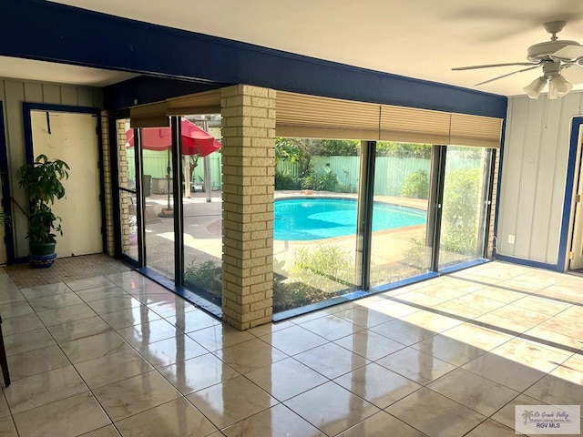 501 W Palm Valley Dr, Harlingen, TX 78552 - doorway to outside featuring tile patterned floors and ceiling fan