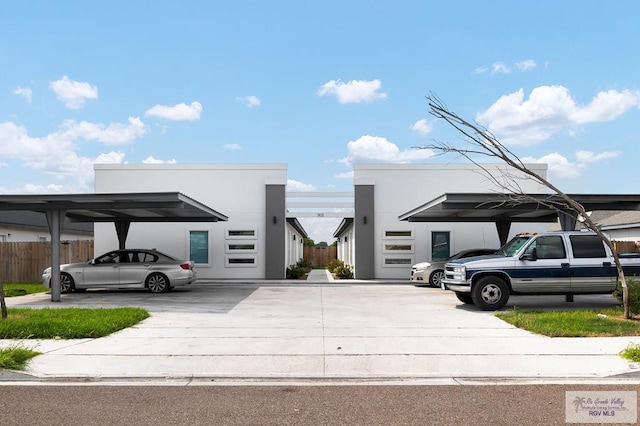 view of vehicle parking featuring a carport