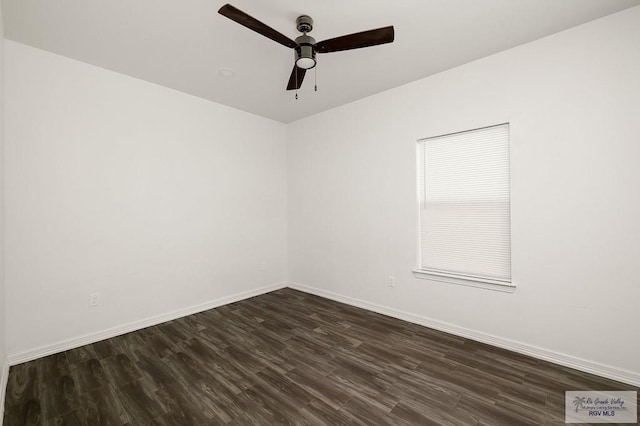 spare room featuring ceiling fan and dark wood-type flooring