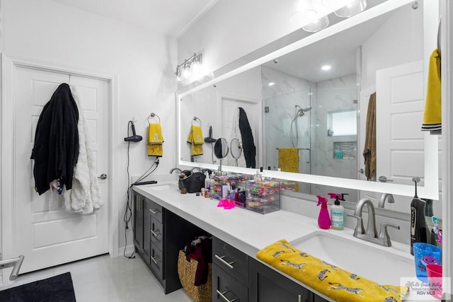 bathroom with vanity, tile patterned floors, and a shower with door