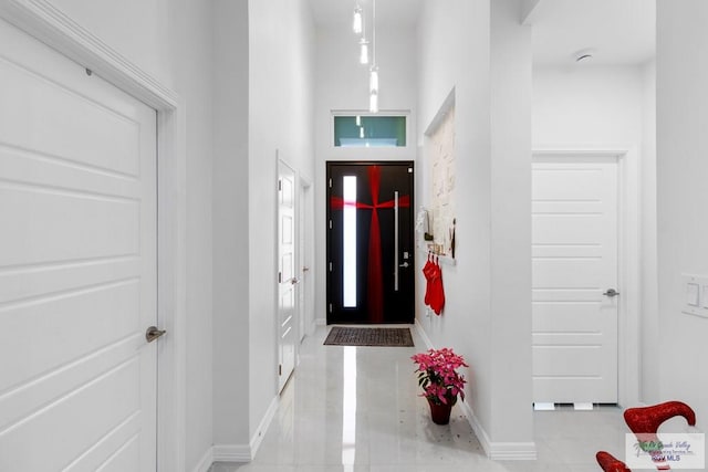 foyer featuring light tile patterned floors