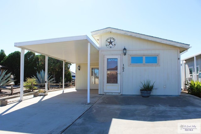 exterior space featuring a carport