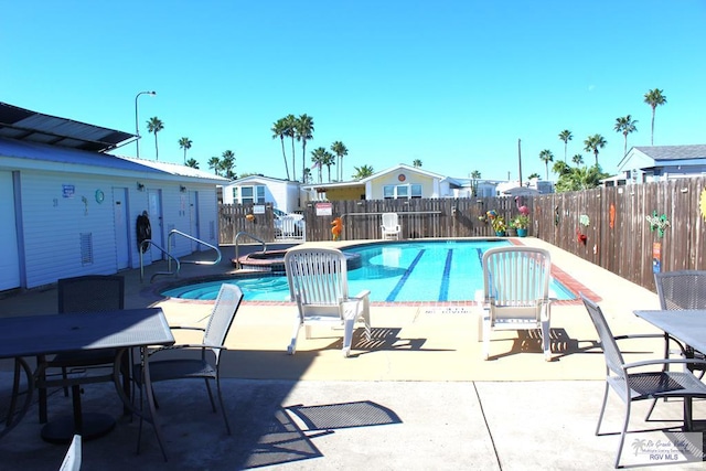 view of swimming pool with a patio area