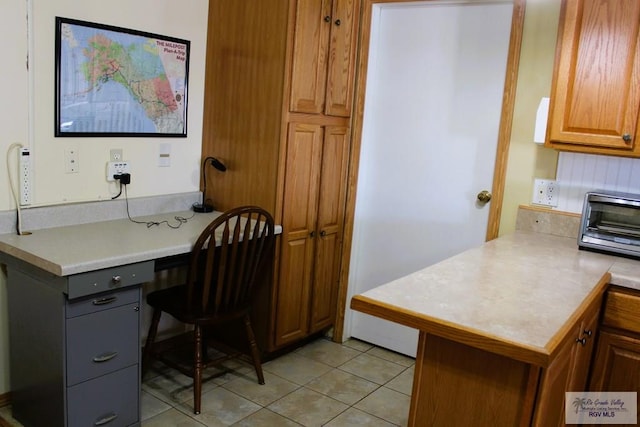 office space with light tile patterned flooring