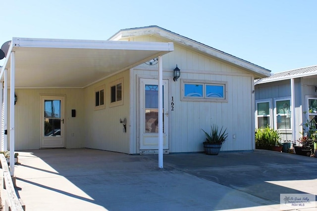 exterior space with a carport