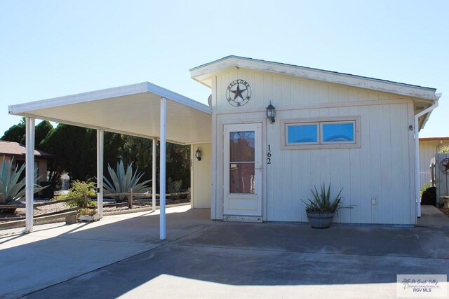 exterior space featuring a carport