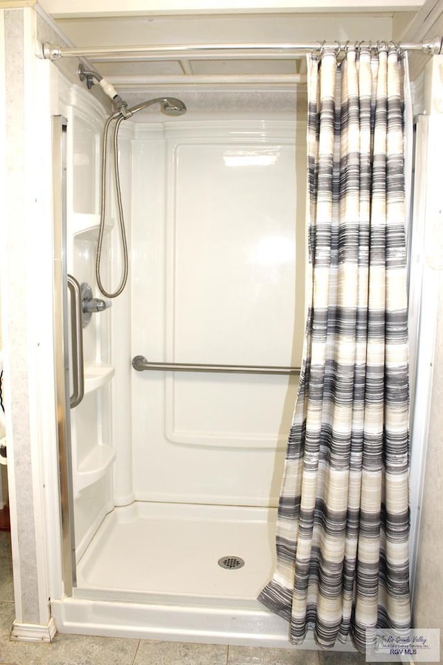 bathroom featuring a shower with curtain