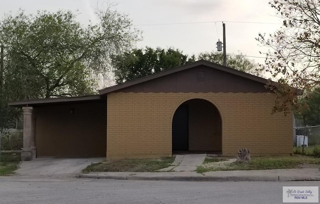 1287 Delpha Dr, Brownsville, TX 78521 - view of front of home featuring brick siding and concrete driveway