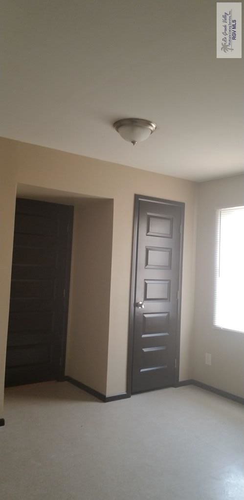 1287 Delpha Dr, Brownsville, TX 78521 - hallway featuring baseboards and light carpet