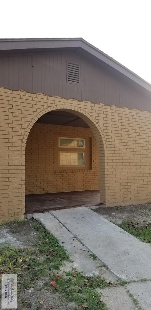 1287 Delpha Dr, Brownsville, TX 78521 - doorway to property with brick siding