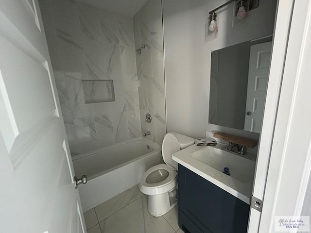 full bathroom featuring tile patterned flooring, vanity, tiled shower / bath combo, and toilet