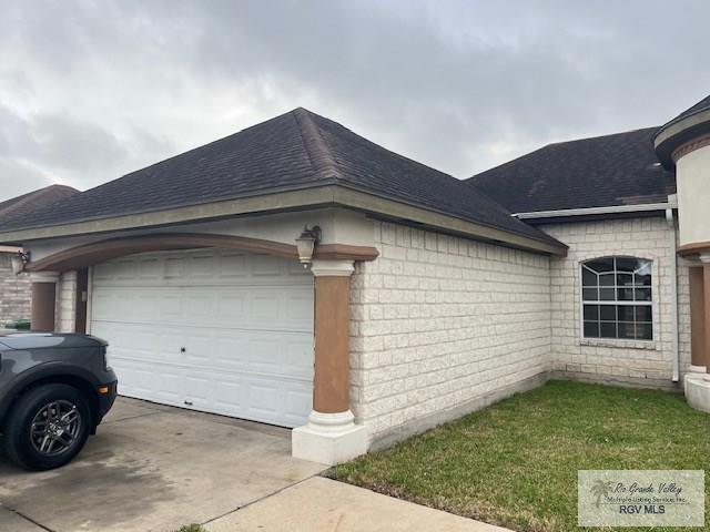 view of side of home with a garage