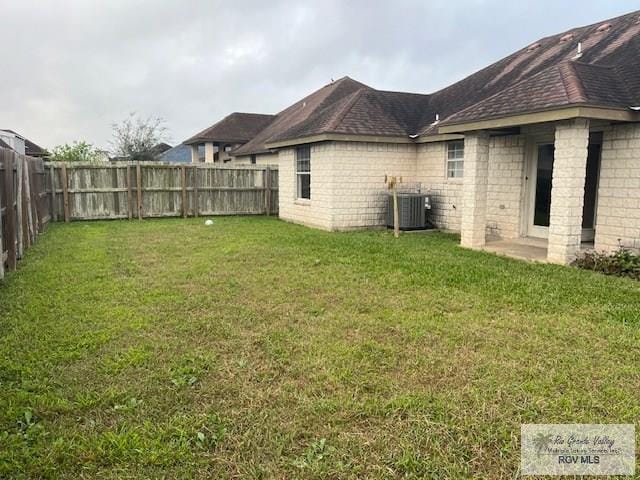 view of yard with central AC