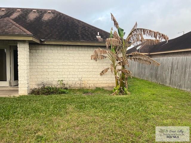 view of home's exterior featuring a yard