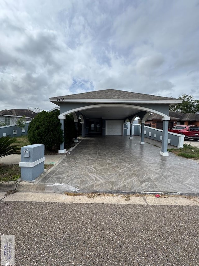 2408 Munich St, Brownsville, TX 78520 - view of vehicle parking featuring driveway and an attached garage