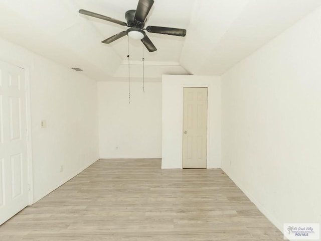 unfurnished room with light hardwood / wood-style flooring, ceiling fan, and lofted ceiling