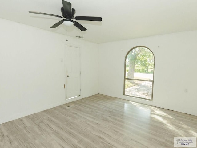 spare room with ceiling fan and light hardwood / wood-style flooring