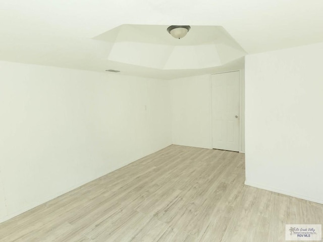 unfurnished room with light wood-type flooring