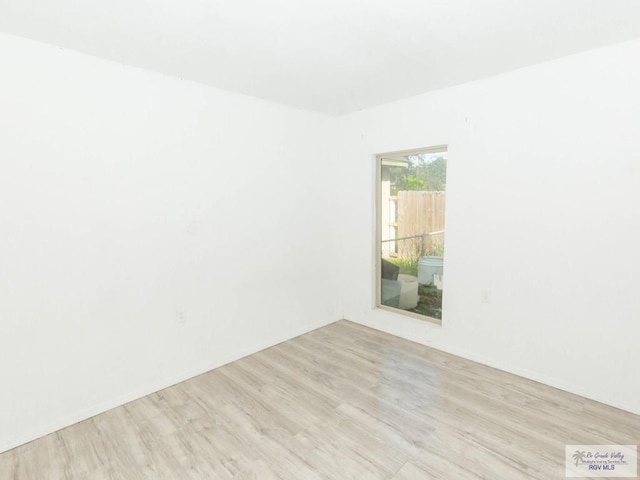 unfurnished room featuring light hardwood / wood-style floors