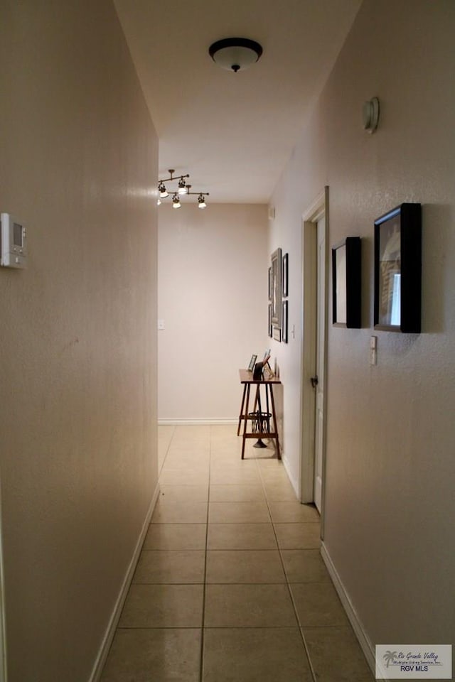 1272 Costa Del Sol Dr, Brownsville, TX 78520 - hall with light tile patterned flooring and baseboards