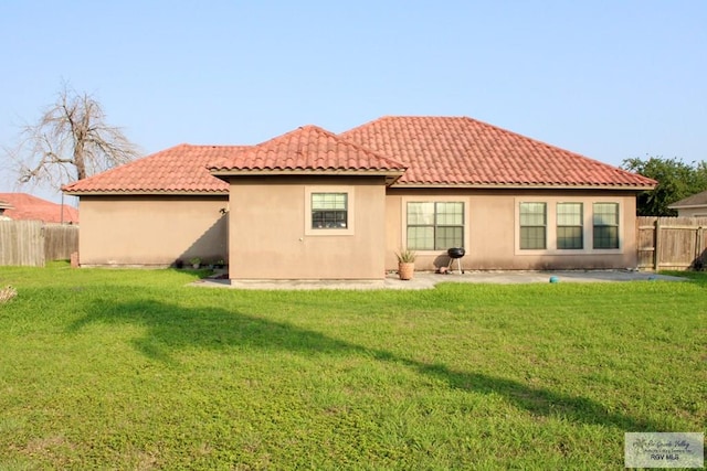 1272 Costa Del Sol Dr, Brownsville, TX 78520 - rear view of house with a tiled roof, a patio, and stucco siding