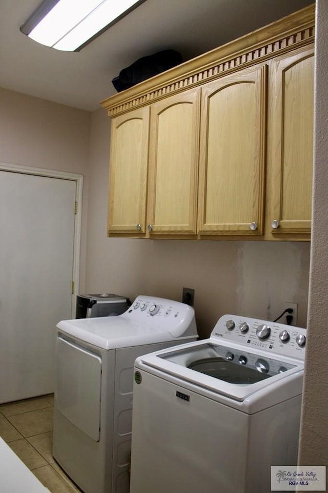 1272 Costa Del Sol Dr, Brownsville, TX 78520 - laundry area with cabinet space, washer and clothes dryer, and light tile patterned flooring