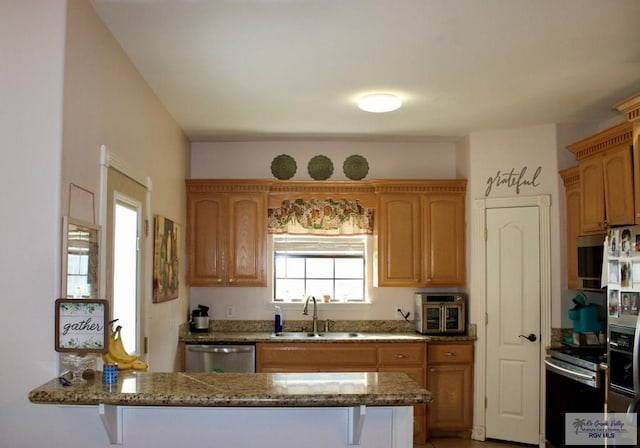 1272 Costa Del Sol Dr, Brownsville, TX 78520 - kitchen with a sink, appliances with stainless steel finishes, and stone countertops