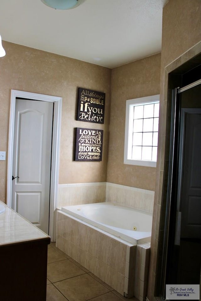 1272 Costa Del Sol Dr, Brownsville, TX 78520 - full bath featuring tile patterned floors, a jetted tub, and vanity