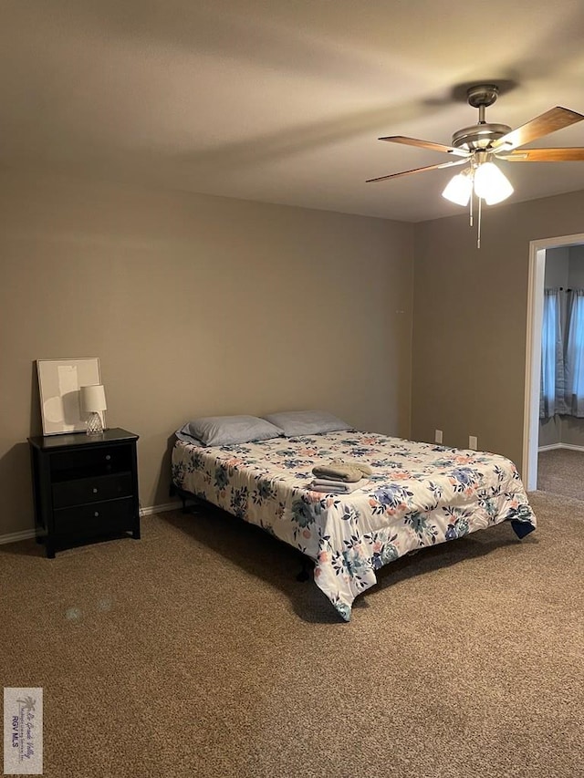 bedroom with ceiling fan, carpet, and baseboards