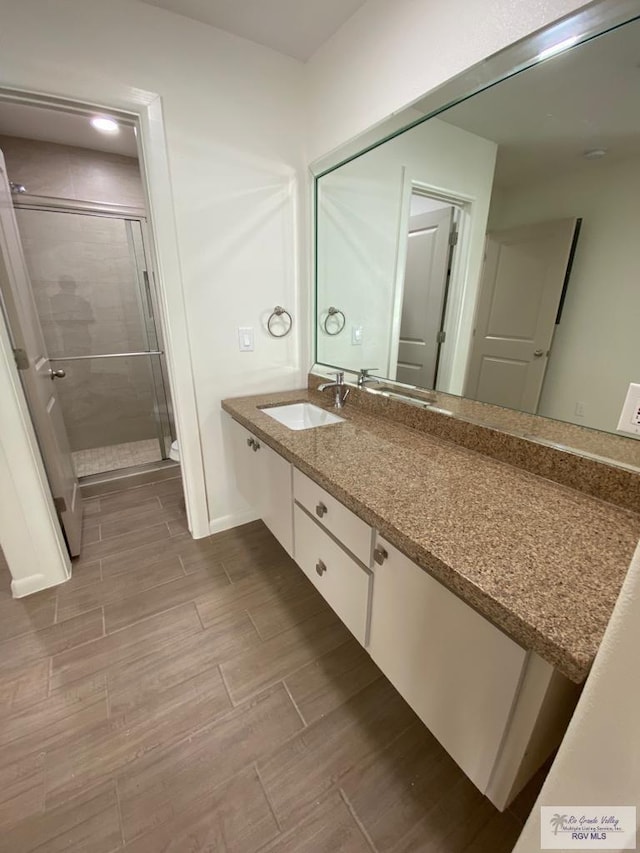 bathroom featuring vanity and walk in shower