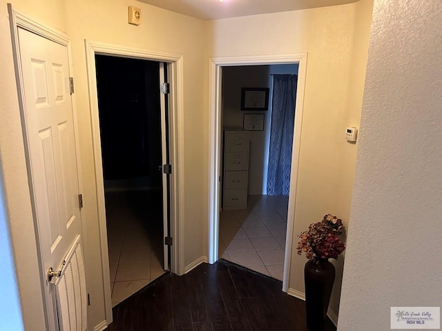 hall with dark hardwood / wood-style floors