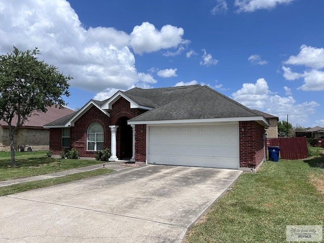 ranch-style home featuring a garage and a front lawn