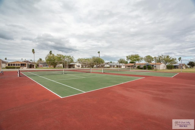 view of tennis court featuring basketball court