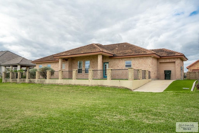 back of property with a lawn and a patio area