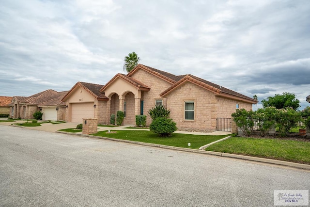 view of front facade featuring a front yard and a garage