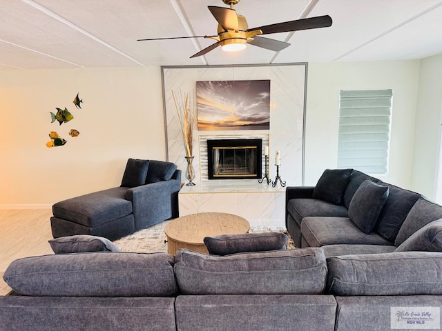 living room with ceiling fan and wood-type flooring