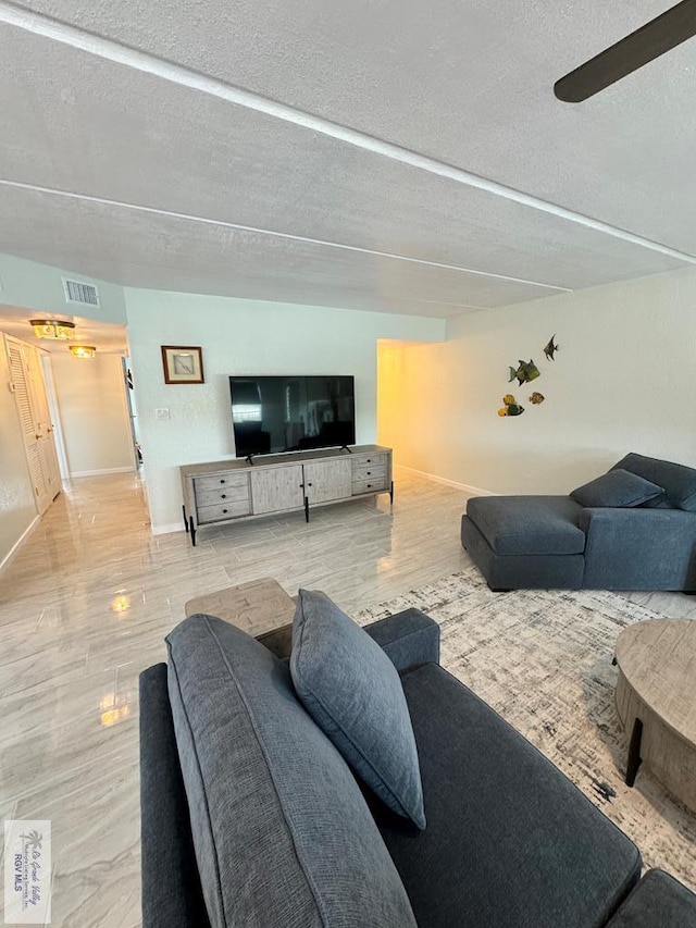 living room featuring a textured ceiling